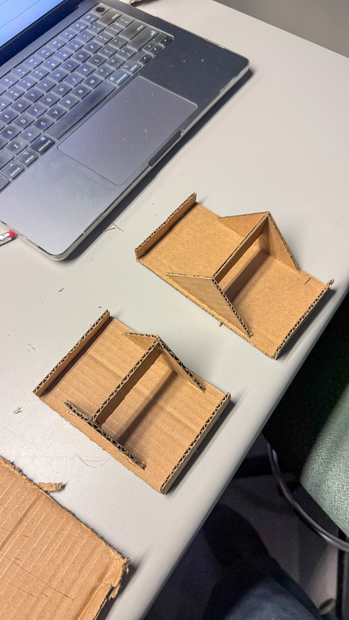 Here, I placed my first and second prototypes side by side to compare their form and balance. The second version (bottom) showed improved alignment and cleaner joints after taking more accurate measurements. While still simple, this comparison helped me see how small adjustments in cutting and assembly can lead to noticeable improvements in stability and overall structure
