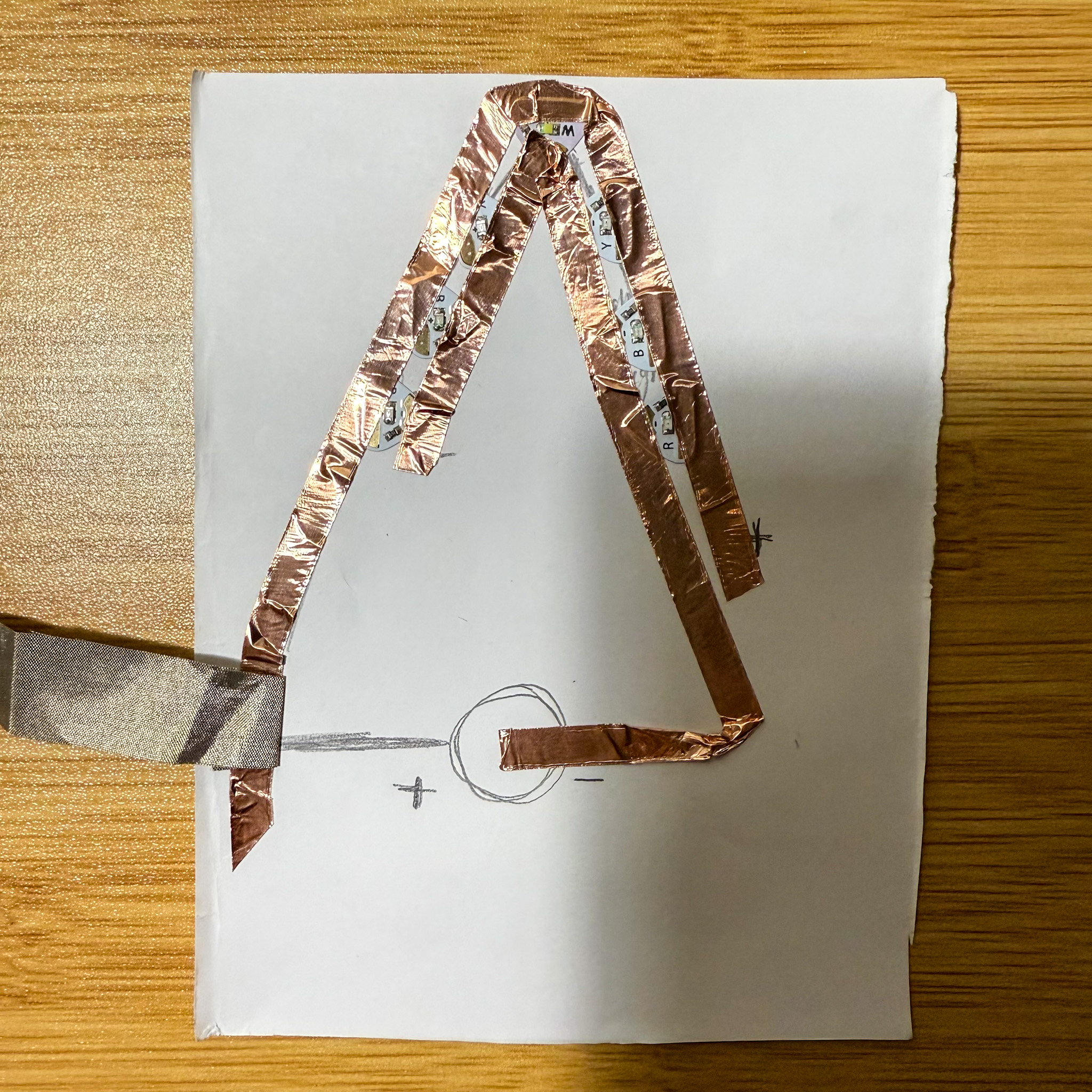 Placing the conductive materials on the circuit. For this circuit, I used conductiv tapes and conductive fabric.