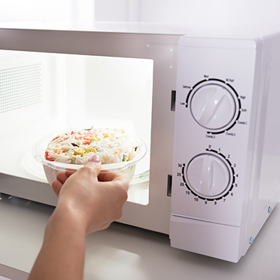 A low, continuous whirring sound of a microwave in operation.